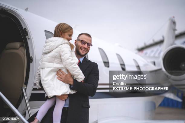 family at the airport - extreme wealth stock pictures, royalty-free photos & images