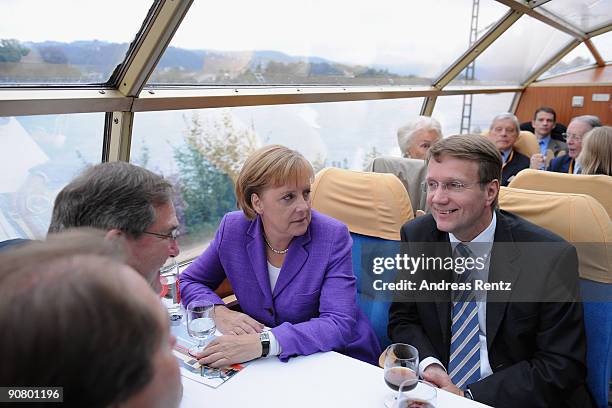 German Chancellor Angela Merkel of the Christian Democratic Union and Ronald Pofalla , General Secretary of the CDU take a seat during their election...