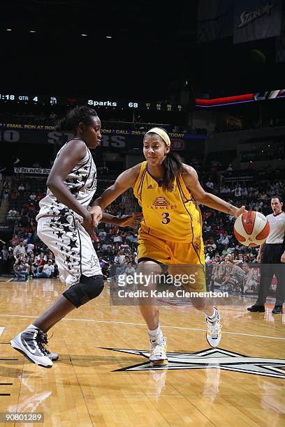 Candace Parker of the Los Angeles Sparks moves the ball against Sophia Young of the San Antonio Silver Stars during the game on September 5, 2009 at...