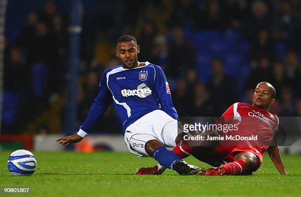 Liam Trotter of Ipswich Town battles with Robert Earnshaw of Nottingham Forest during the Coca Cola Championship match between Ipswich Town and...