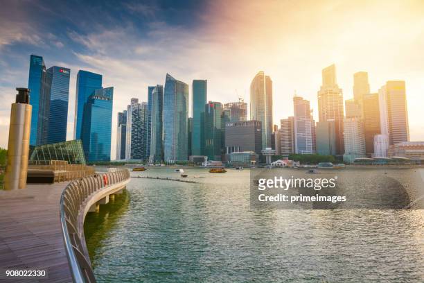 panoramic  view of the singapore skyline and marina bay - marina bay - singapore stock pictures, royalty-free photos & images
