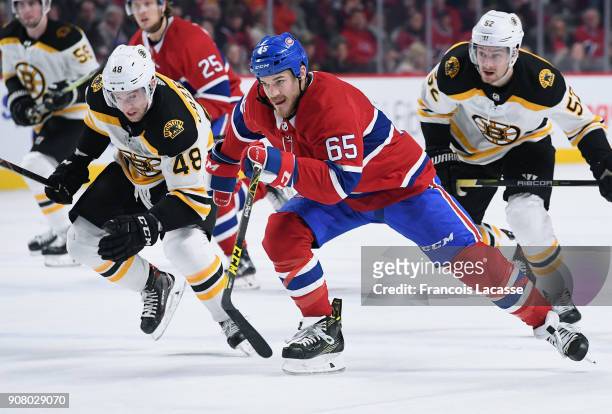 Andrew Shaw of the Montreal Canadiens skates against Matt Grzelcyk of the Boston Bruins in the NHL game at the Bell Centre on January 13, 2018 in...