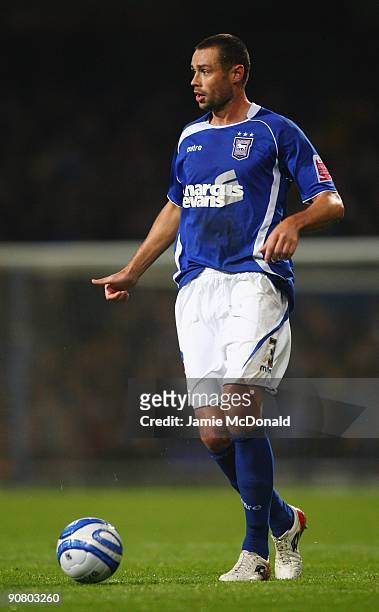 Damien Delaney of Ipswich Town runs with the ball during the Coca Cola Championship match between Ipswich Town and Nottingham Forest at Portman Road...