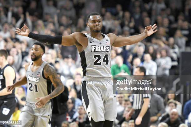 Kyron Cartwright of the Providence Friars celebrates a shot during a college basketball game against the Providence Friars at Duncan' Donut Center on...