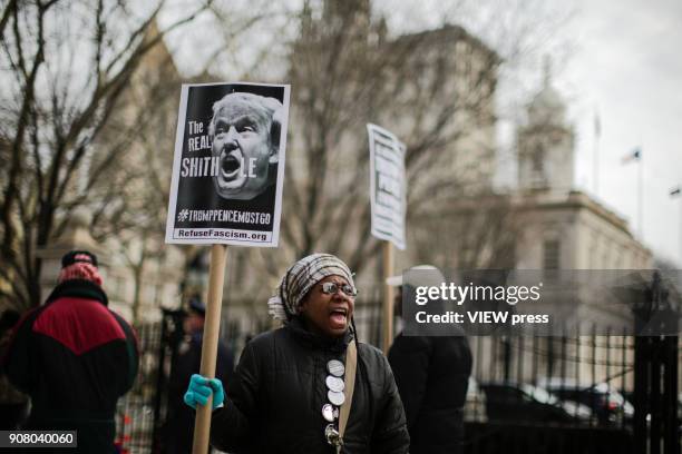 Woman shouts slogans against government as people take part in a protest against U.S. President Donald Trump's recent statements and words about...
