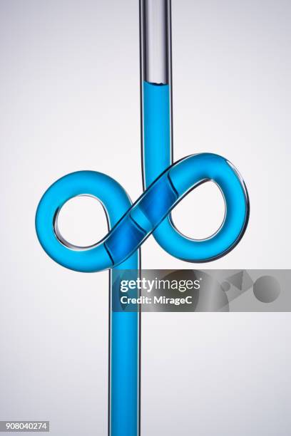 infinity symbol shaped glass tube - tube stock pictures, royalty-free photos & images