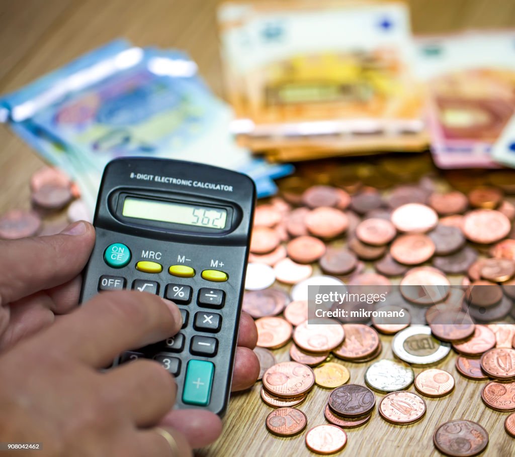 Monthly Expense Calculation Closeup Of Mans Hand Using Calculator To ...
