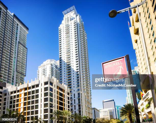 miami brickell avenue sign and skyscrapers tilted view - street style miami march 2017 stock pictures, royalty-free photos & images