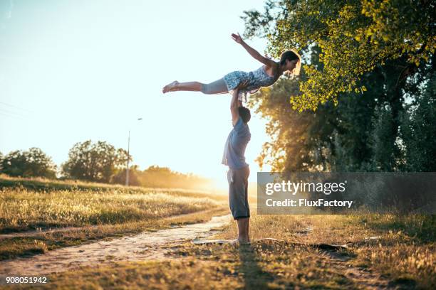 freedom - acroyoga stock pictures, royalty-free photos & images