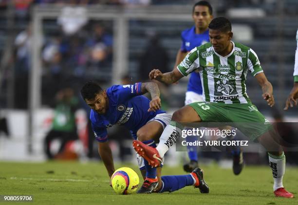 Cruz Azul's midfielder Walter Montoya vies for the ball with Leon's midfielder Alexander Mejia during their Mexican Clausura football tournament...