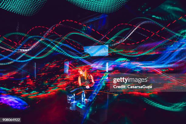 young female dj performing, light painting - electronic music stock pictures, royalty-free photos & images