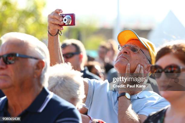 Man takes photographs of the official opening proceedings at Optus Stadium on January 21, 2018 in Perth, Australia. The 60,000 seat multi-purpose...