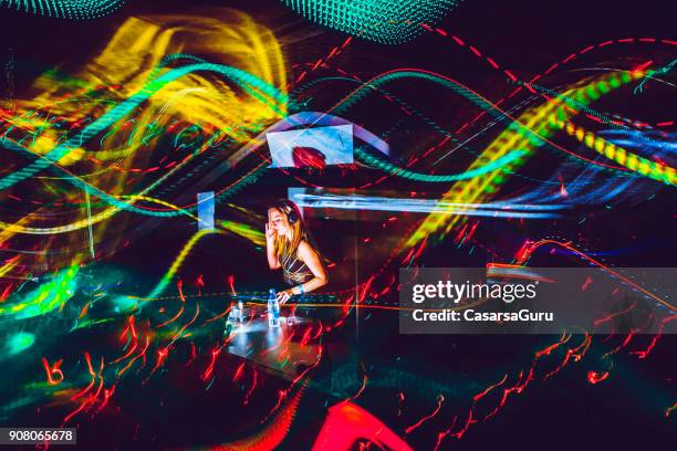 young female dj performing, light painting - electronic music stock pictures, royalty-free photos & images