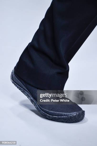 Model, shoe detail, walks the runway during the Issey Miyake Men Menswear Fall/Winter 2018-2019 show as part of Paris Fashion Week on January 18,...