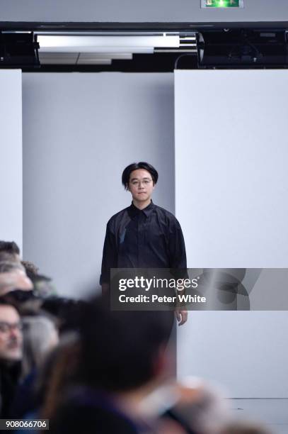 Yusuke Takahashi acknowledges the audience after the Issey Miyake Men Menswear Fall/Winter 2018-2019 show as part of Paris Fashion Week on January...