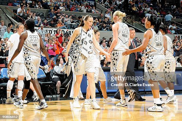 Sophia Young, Erin Perperoglou, Ann Wauters, Helen Darling and Vickie Johnson of the San Antonio Silver Stars walk to the bench during the WNBA game...