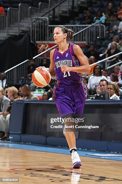 Ticha Penicheiro of the Sacramento Monarchs moves the ball against the Atlanta Dream during the game at Philips Arena on August 25, 2009 in Atlanta,...