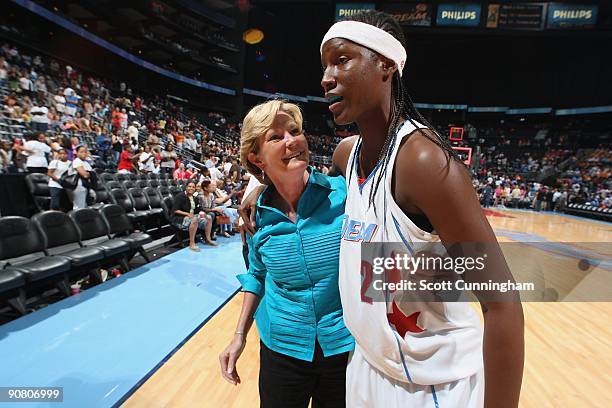 Head Coach Pat Summitt of the University of Tennessee Volunteers talks with her former player Michelle Snow of the Atlanta Dream following the game...