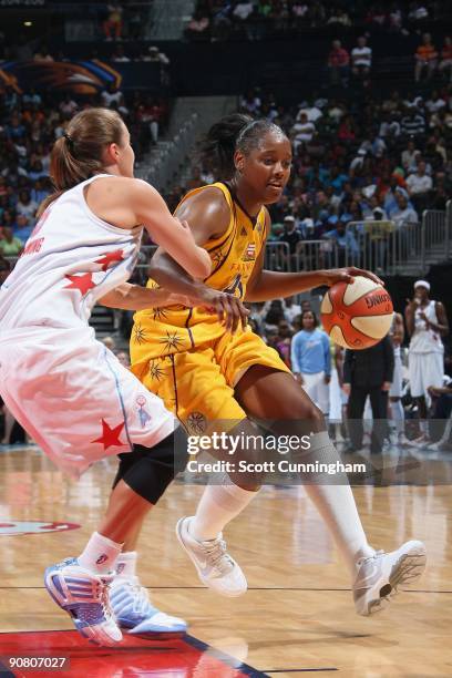 Noelle Quinn of the Los Angeles Sparks moves the ball against Shalee Lehning of the Atlanta Dream during the game at Philips Arena on August 23, 2009...