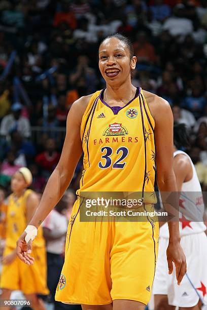 Tina Thompson of the Los Angeles Sparks cracks a smile during the game against the Atlanta Dream at Philips Arena on August 23, 2009 in Atlanta,...
