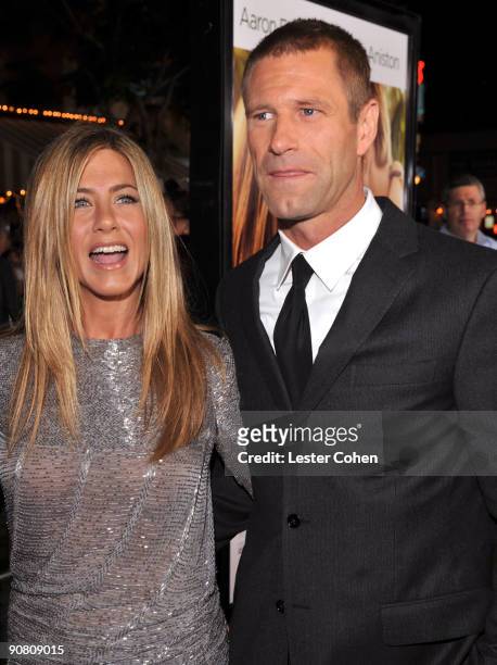 Actress Jennifer Aniston and actor Aaron Eckhart arrive on the red carpet at the Los Angeles premiere of "Love Happens" at the Mann's Village Theatre...