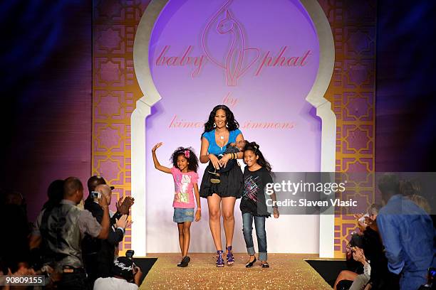 Designer Kimora Lee Simmons with children Aoki Lee, Kenzo Lee Hounsou and Ming Lee on the runway at the Baby Phat & KLS Collection Spring 2010...
