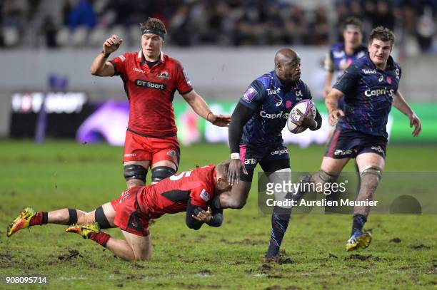 Djibril Camara of Stade Francais is tackled by Darcy Graham of Edinburgh during the European Rugby Challenge Cup match between Stade Francais and...