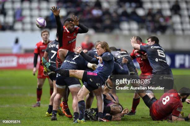 Charl McLeod of Stade Francais kicks the ball during the European Rugby Challenge Cup match between Stade Francais and Edinburgh at Stade Jean-Bouin...