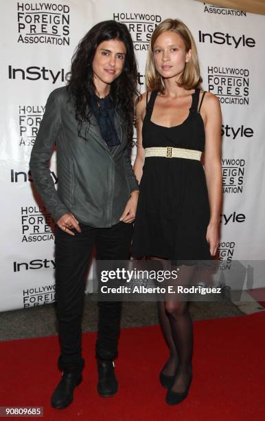 Writer/director Francesca Gregorini and actress Amy Ferguson arrive at the InStyle and HFPA Toronto Film Festival Party held at the Courtyard Cafe on...