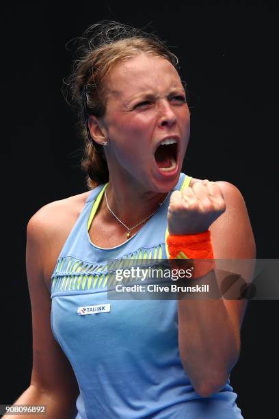 Anett Kontaveit of Estonia celebrates winning a point in her fourth round match against Carla Suarez Navarro of Spain on day seven of the 2018...