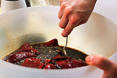 Mixing a batch of meat marinading for jerky