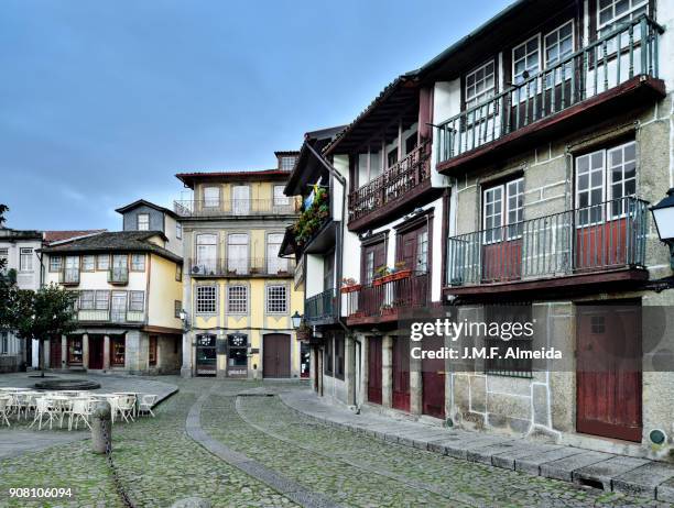 medieval houses at guimarães - braga district stock-fotos und bilder