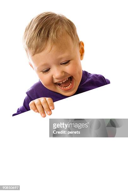 boy on the lookout and smiling - kid peeking stock pictures, royalty-free photos & images