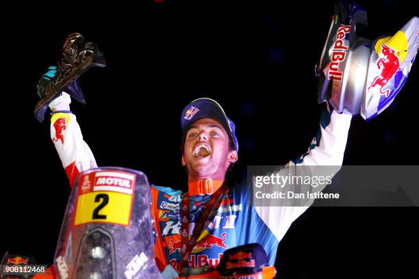 Matthias Walkner of Austria and Red Bull KTM celebrates victory on the podium after stage fourteen of the 2018 Dakar Rally, a loop stage to and from...