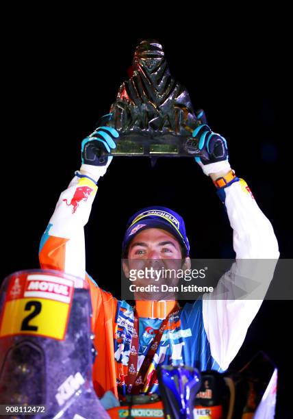 Matthias Walkner of Austria and Red Bull KTM celebrates victory on the podium after stage fourteen of the 2018 Dakar Rally, a loop stage to and from...