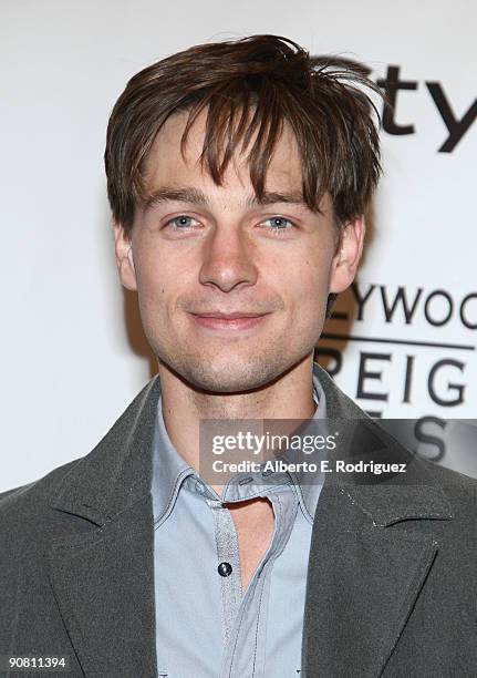 Actor Gregory Smith arrives at the InStyle and HFPA Toronto Film Festival Party held at the Courtyard Cafe on September 15, 2009 in Toronto, Canada.