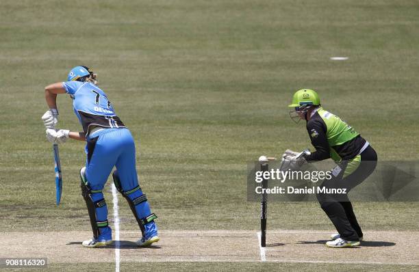 Strikers Sophie Devine is bowled out by Rene Farrell during the Women's Big Bash League match between the Adelaide Strikers and the Sydney Thunder at...