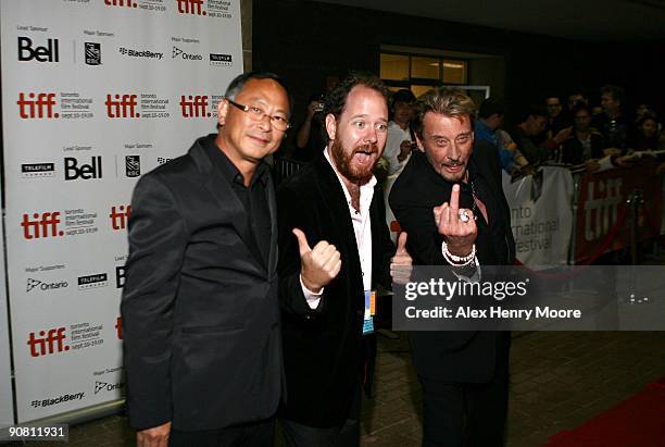 Director Johnnie To, TIFF Programmer Colin Geddes, and French Singer/Actor Johnny Hallyday attend the "Vengeance" Premiere held at the Ryerson...