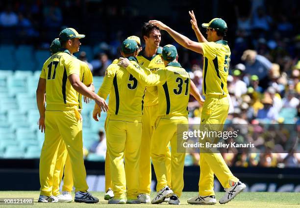 Pat Cummins of Australia is congratulated by team mates after taking the wicket of Jason Roy of England during game three of the One Day...