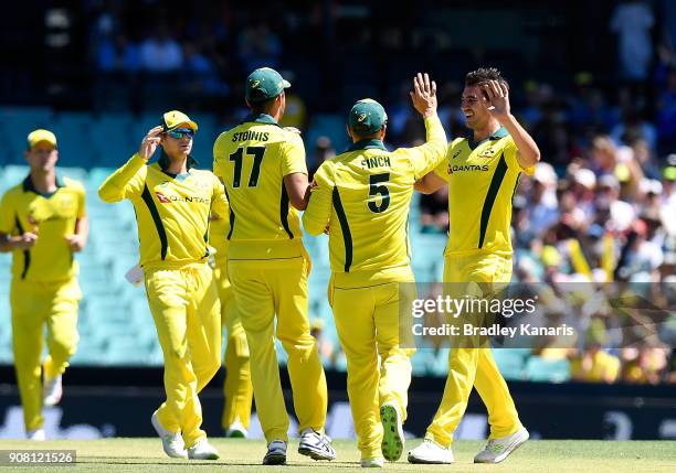 Pat Cummins of Australia is congratulated by team mates after taking the wicket of Jason Roy of England during game three of the One Day...
