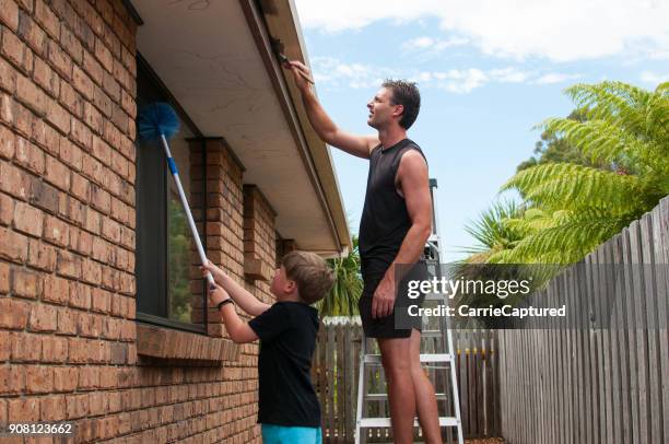 painting roof gutters - garden renovation stock pictures, royalty-free photos & images