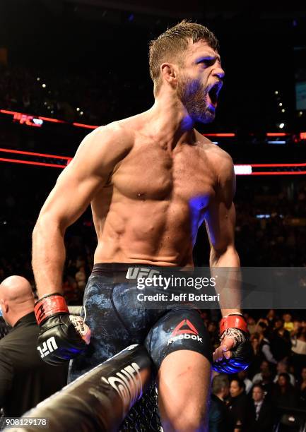 Calvin Kattar celebrates after his knockout victory over Shane Burgos in their featherweight bout during the UFC 220 event at TD Garden on January...