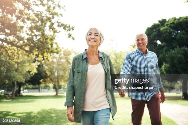 staying in love is something very special - couple walking in park stock pictures, royalty-free photos & images