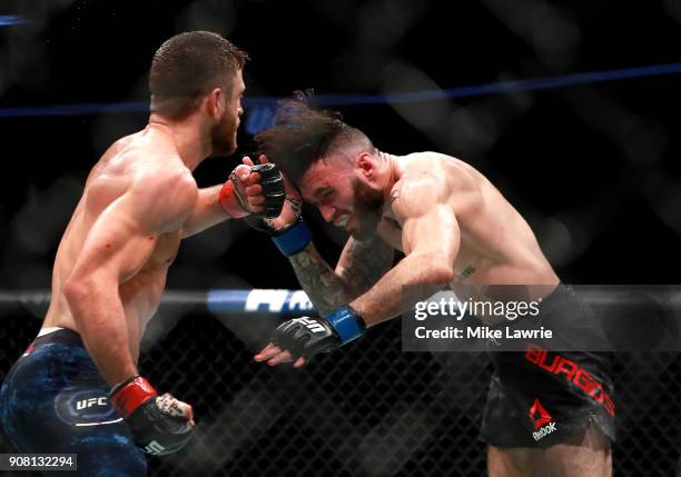 Calvin Kattar throws a punch against Shane Burgos in their Featherweight fight during UFC 220 at TD Garden on January 20, 2018 in Boston,...