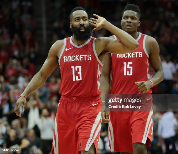 James Harden of the Houston Rockets signals to the crowd after he made a three-point shot late in the game against the Golden State Warriors at...