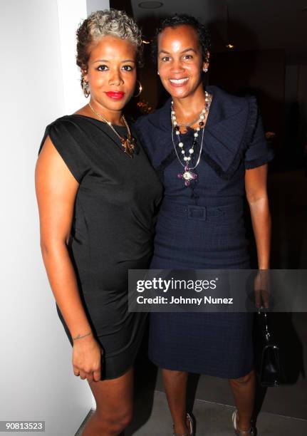 Kelis and Erica Reid attend the opening gala at the Hair Rules New York Salon on September 15, 2009 in New York City.