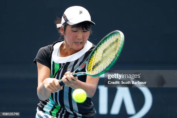 Anri Nagata of Japan plays a backhand against Diane Parry of France during the Australian Open 2018 Junior Championships at Melbourne Park on January...