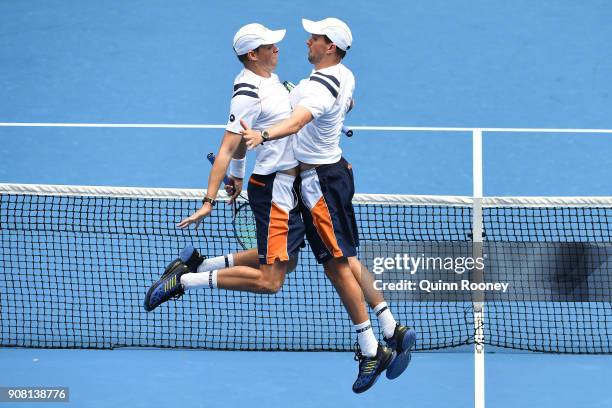 Bob Bryan of the United States and Mike Bryan of the United States celebrate in their third round match against Jeremy Chardy of France and Fabrice...