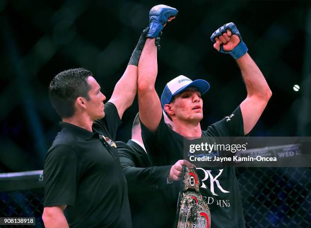 Referee Jason Herzog raises the hand of the new Welterweight World Champion Rory MacDonald after defeating Douglas Lima at Bellator 192 at The Forum...