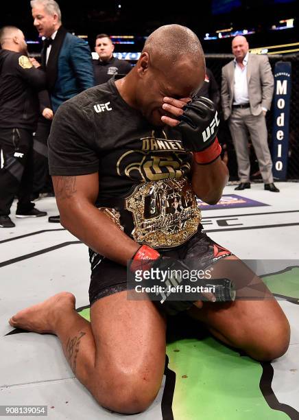 Daniel Cormier celebrates after his TKO victory over Volkan Oezdemir of Switzerland in their light heavyweight championship bout during the UFC 220...
